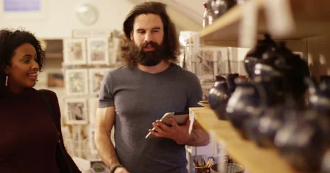 Dealing with sales at a ceramics shop. Stock Footage 60231210