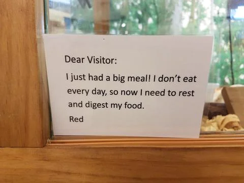 Dear visitor I just had a big meal sign on snake cage Stock Photos