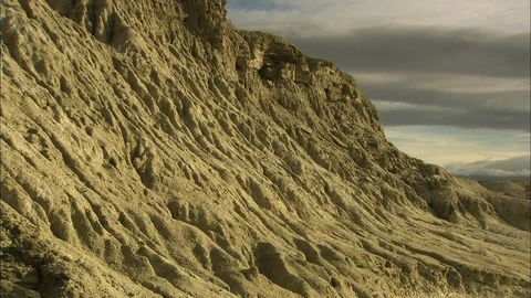 Death Valley cliffs pan to long range view Stock Footage 86941252
