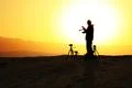 Death Valley Man and cameras silhouette at sand dunes Photo