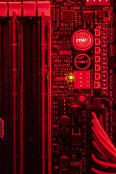  Deatil of Start and reset button inside a pc in red lght Start and reset ... Stock Photos