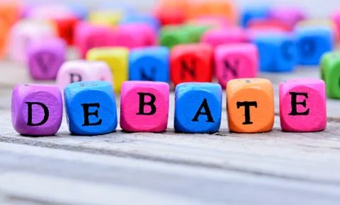 Debate word on table Stock Photos