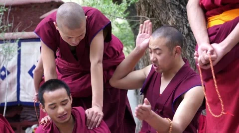 Debating and waving hands monks at Sera Monastery, Lhasa Stock Footage 44032718