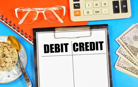 Debit and credit. Text label in the working document. Stock Photos