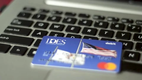 A debit card for Unemployment Insurance payments in Illinois Stock Footage