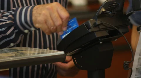 A Debit or credit card being swiped Stock-Footage 40169976