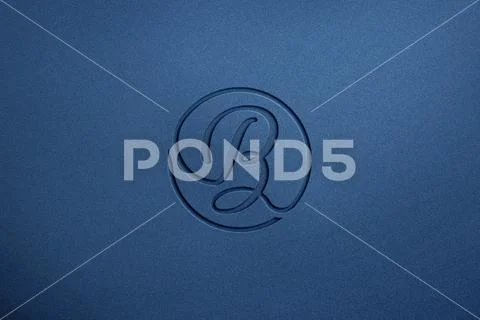 Debossed effect logo mockup on blue wall texture PSD Template