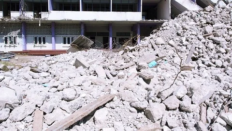 Debris and destroyed building that collapsed from the earthquake. Stock Footage 116076790