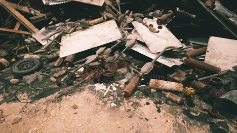 Debris and discarded items scattered across a construction site in daylight Stock Footage 304513067