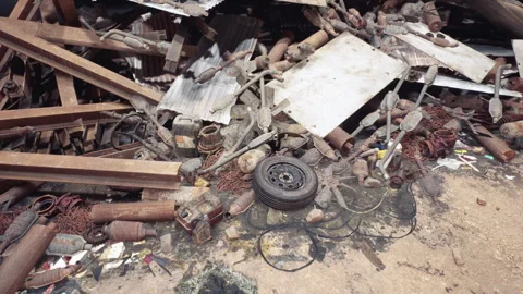 Debris and discarded materials cluttered in a construction site environment Stock Footage 308529466