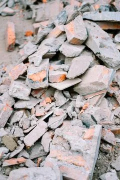 Debris from a construction site, featuring broken bricks, concrete fragment.. Stock Photos