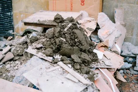 Debris from a construction site, featuring broken bricks, concrete fragment.. Stockfoto's