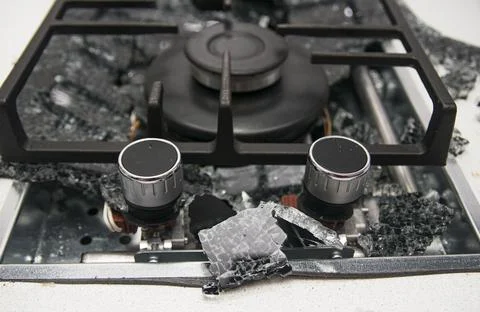 Debris from the explosion of a built-in gas hob in a glass ceramic hob in a k Stock Photos