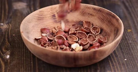 Debris left after peeling the hazelnuts from the shell Video stock 233654172