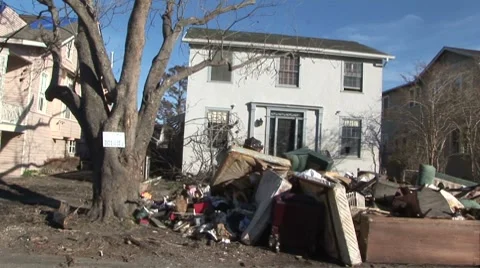 Debris piled outside house after Hurricane Katrina Video stock 8652940