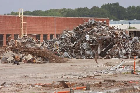 Debris Is Stacked High At Auto Assembly Plant Demolition Site Stock Photos