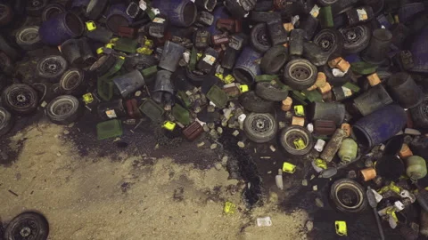 Debris from tires and packaging scattered over damp shoreline scene Stock Footage 341831865