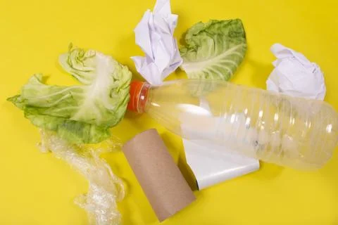 Debris on a yellow background, environmental issues Stock Photos