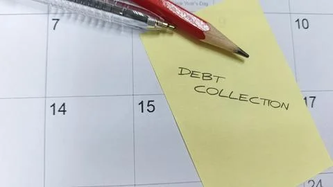 "Debt Collection" written on a sticky note attached to a calendar, acting a.. Stock Photos