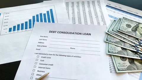 Debt consolidation loan document with graph on table. Stock Footage