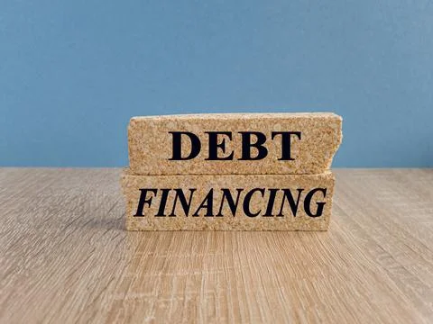 Debt financing symbol. Concept words Debt financing on brick blocks Stock Photos