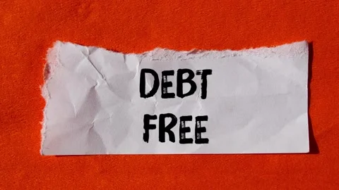 Debt free message written on ripped torn paper background. Conceptual Debt .. Stock Footage 333313315