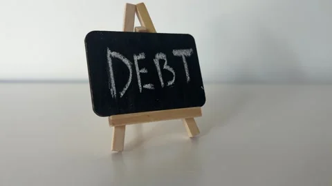 Debt Written On Small Blackboard Sign With Chalk For Personal Finance And Loan Stock-Footage 339064008