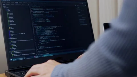 The Debugger Encodes. Close-up of the Laptop, Script, and Hands. A Female Develo Vidéo 144884865