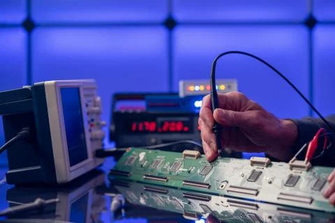 Debugging electronics device. PCB witch microcontroller in electronics labora 写真素材