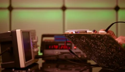 Debugging electronics device. PCB witch microcontroller in electronics labora Stock Photos