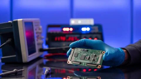 Debugging electronics device. PCB witch microcontroller in electronics labora 写真素材