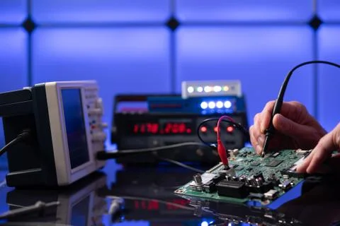 Debugging electronics device. PCB witch microcontroller in electronics labora Stock Photos