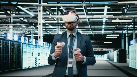 Debugging system errors, VR headset and computer scientist in data center Stock Footage 329531797
