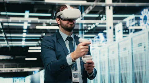 Debugging system errors, VR headset and computer scientist in data center Stock Footage 329591231