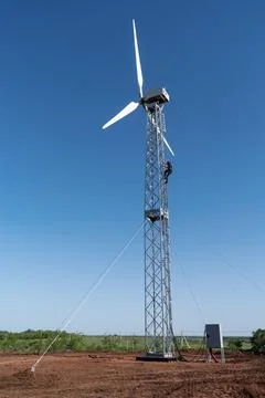 Debugging work on a new wind turbine in the countryside Stock Photos