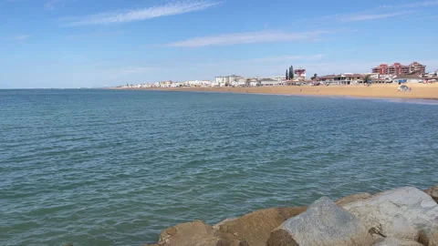 Dec 15 2025 La Antilla Huelva Spain Beach Turquoise Sea Rocks Sunny Winter Stock Footage 335236024