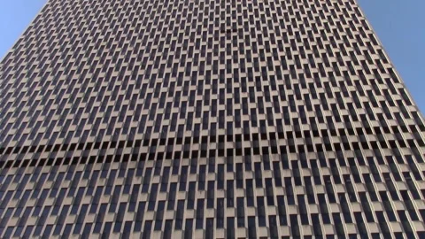 Dec. 18, 2024: Jacob J Javits Building establishing pan-up shot Stock Footage 295873061
