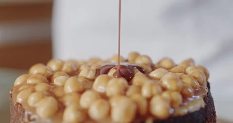 Decadent Nut Topped Cake Drizzled with Rich Caramel Stock Footage 266681270