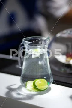 Decanter with lime water Stock Photos