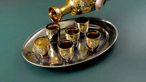 From the decanter poured wine into glasses. Service retro. Stock Footage 120248853