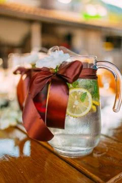 Decanters with fruit lemonade on the table at the wedding 스톡 사진