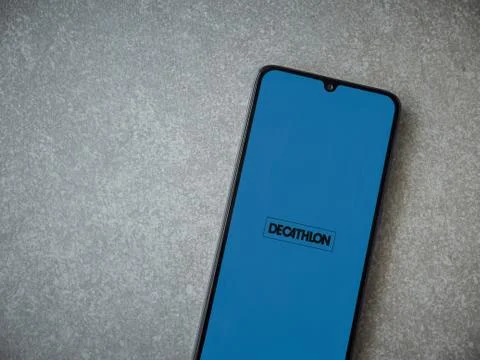 Decathlon Scan &amp; Go app launch screen with logo on the display of a black mob Stock Photos