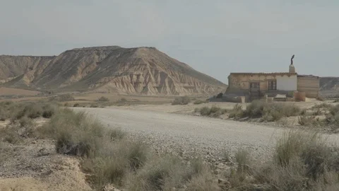 Decayed abandoned house isolated and dry nature with a huge mountain in the Video stock 110770678