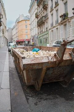 Decayed and Weathered Construction Container Filled with Waste Stock Photos