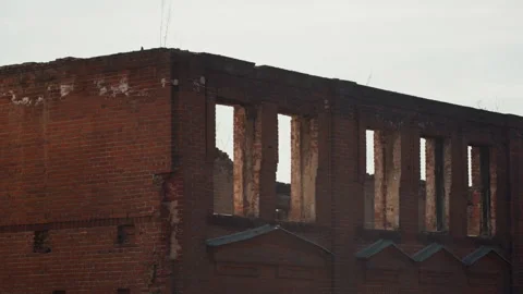 Decayed brick wall with abandoned window spaces. Ancient industrial building Stock Footage 342429133