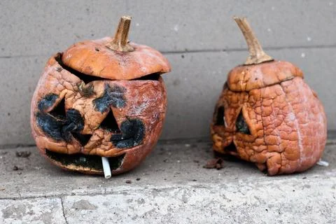 Decayed Jack-o'-Lanterns on Steps, Post-Halloween Sadness, Cigarette Stock Photos