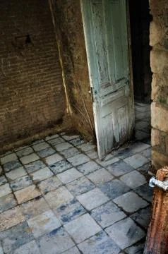 Decayed room interior with tiled floor Stock Photos