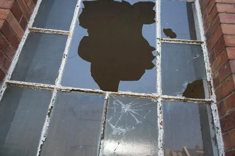 Decaying Broken Window With Peeling Paint And Brick Wall In Bulcote, England. Stock Photos