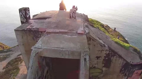 Decaying Coastal Bunker at sunset - Aerial Stock Footage 47382124