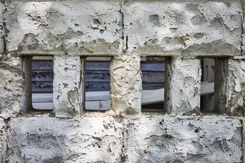 Decaying Concrete Wall with Rectangular Openings, Eye-Level View Photos